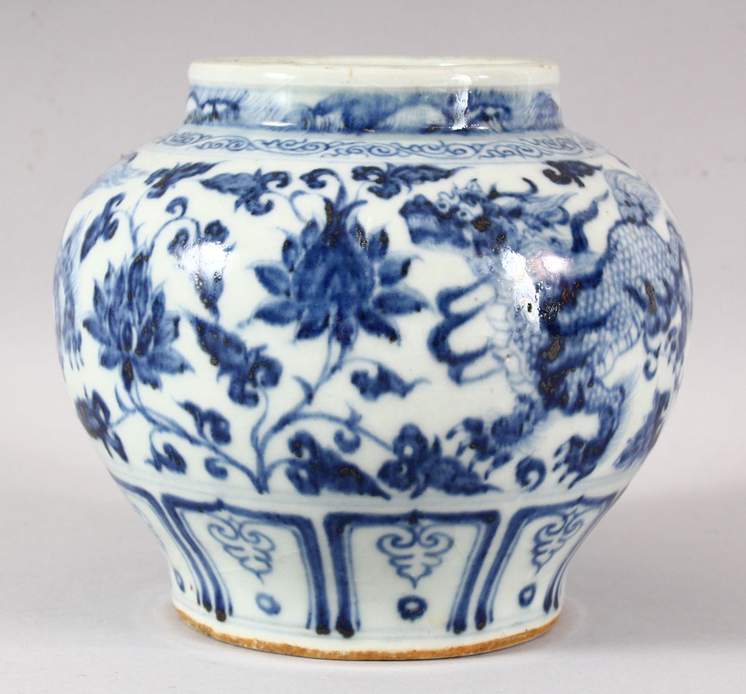 A CHINESE BLUE AND WHITE GLAZED POTTERY VASE, the body painted with kylin and stylised flora, 15.5cm