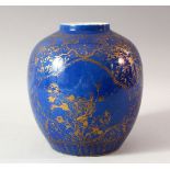 A CHINESE BLUE GROUND AND GILT DECORATED JAR, the body painted with panels of flowers, floral motifs