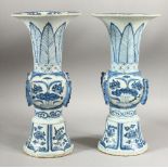 A PAIR OF CHINESE PORCELAIN GU SHAPED VASES, 31cm high.