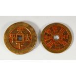 TWO CHINESE CURRENCY COINS - with residual poly chrome decorations 5.6cm & 6cm
