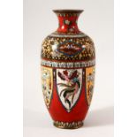 A JAPANESE MEIJI CLOISONNE VASE, with panels of stylised dragons and phoenix, 18cm high.