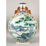 A LARGE AND IMPRESSIVE CHINESE DOUCAI PORCELAIN TWIN HANDLE MOONFLASK, the body painted with a panel