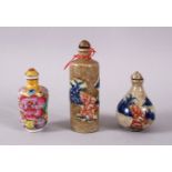 THREE CHINESE PORCELAIN SNUFF BOTTLES, one of floral design, the other two with underglaze blue