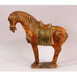 A CHINESE TANG STYLE SANCAI POTTERY MODEL OF A HORSE, 25cm