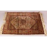 A SMALL TURKISH SILK RUG, 91cm X 62cm.