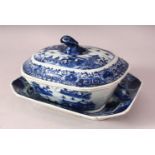AN 18TH CENTURY CHINESE BLUE & WHITE PORCELAIN TUREEN, COVER & STAND, decorated with native