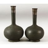 A PAIR OF INDIAN BIDRI BOTTLES, the upper neck with silver inlay, each approx. 26.5cm.