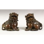 A PAIR OF CHINESE BRONZE CENSERS modelled as kylins, 15cm high.