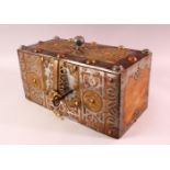 A FINE NORTH AFRICAN TUAREG STEEL, COPPER AND BRASS BOUND WOODEN CASKET, with pierced and