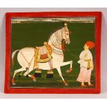 A FINE 19TH CENTURY INDIAN MINIATURE PAINTING OF A MAN AND HIS HORSE, with gilt highlights,