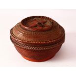 A JAPANESE MEIJI PERIOD WOVEN IKEBANA BASKET & COVER - of woven form with a ring handle, 19.5cm