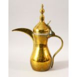 A TURKISH BRASS COFFEE POT - the side with an impressed mark, 32cm