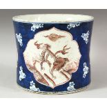 A LARGE CHINESE BLUE AND IRON RED BRUSH POT, decorated with panels of kylin, the base with six