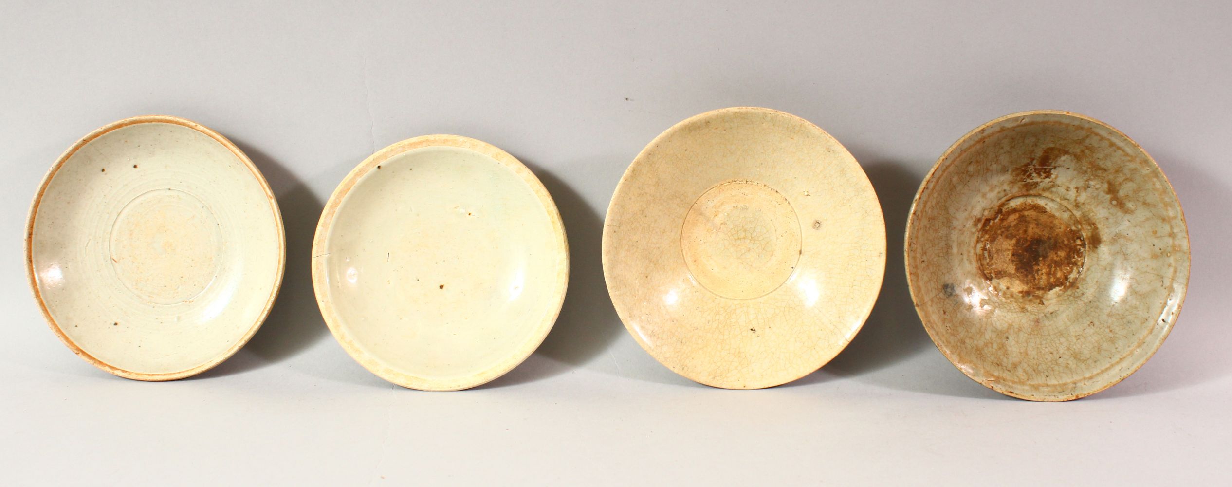 FOUR CHINESE TERRACOTTA BOWLS, various sizes, approx. 16cm diameter.