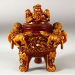 A CHINESE RED AND GILT LACQUERED WOOD TRIPOD CENSER AND COVER, with twin handles and handle rings,