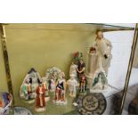 A good collection of Staffordshire figures to include a large figure of Shakespeare together with