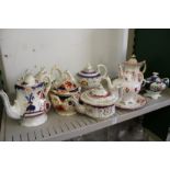 19th century lustre decorated teapots, sucriers and stands.