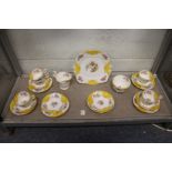 An unusual Paragon china part service, white ground with floral and exotic bird decoration and