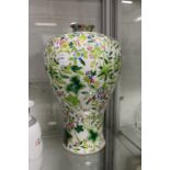 A large Chinese Meiping porcelain vase decorated with flowers and foliage.