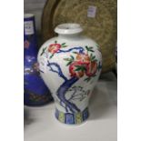A Chinese Meiping shaped vase painted with a peach tree.