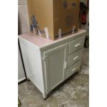 An old painted kitchen cupboard unit.