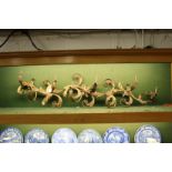 A decorative naturalistic shaped ormolu eight branch light fitting.