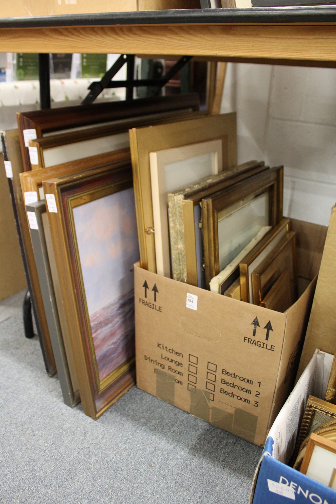 A quantity of paintings and prints.