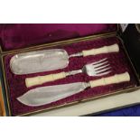 A good cased set of fish servers with matching crumb scoop, all with faux bamboo handles.