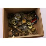 A good collection of military badges and buckles etc.