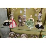 A pair of Susie Cooper coffee cups and saucers, a Royal Doulton figurine "Janet" and another "