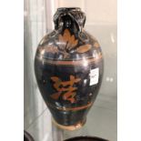 A Chinese large bottle vase decorated with calligraphy.