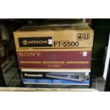 A Hitachi stereo tuner, a Sony stereo tuner and a Panasonic DVD player, all boxed.