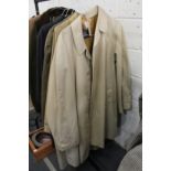 A gentlemen's classic Burberry beige raincoat and a similar coat.