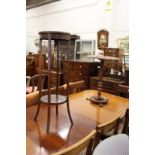 A mahogany occasional table and a jardiniere stand.