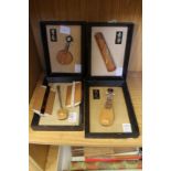 Four small Japanese models of musical instruments and two Japanese combs.