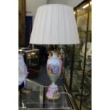 A continental porcelain lamp.