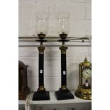 A large pair of decorative Corinthian column storm lanterns.