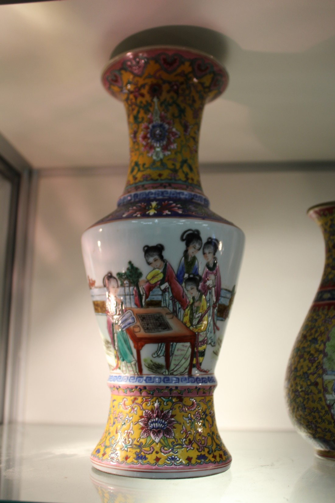 A Chinese Famille Jaune baluster shaped vase, the body decorated with female figures. - Image 2 of 2