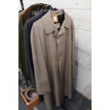 A gentlemen's Aquascutum beige coloured raincoat and similar navy raincoat.