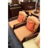 A pair of mahogany framed Bergere armchairs.