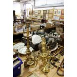 A large brass five branch chandelier and a gilt plaster lamp.