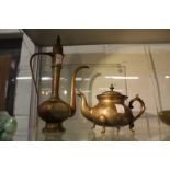 An eastern brass ewer and similar teapot.