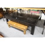 A modern large ebonised square shaped coffee table.