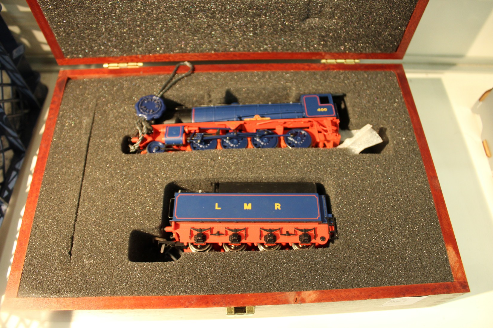 A Bachmann railway locomotive with matching tender in a fitted wooden case.