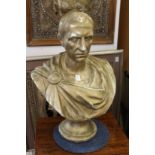 A painted plaster bust of Julius Caesar.