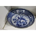 A Japanese circular blue and white bowl (faults).