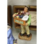 A Royal Doulton figure "Organ Grinder" HN2173.