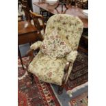 A Victorian mahogany framed open armchair.