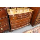 A mahogany bow front multi drawer chest.