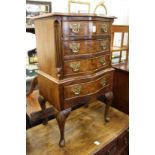 A small reproduction mahogany serpentine fronted chest.